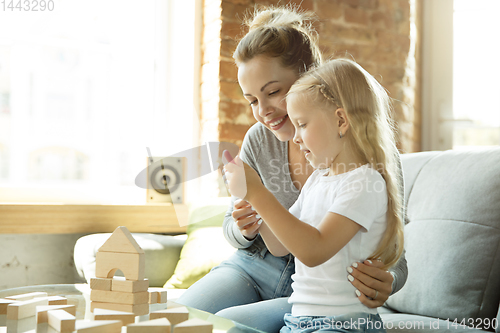 Image of Teacher and little girl, or mom and daughter. Homeschooling concept