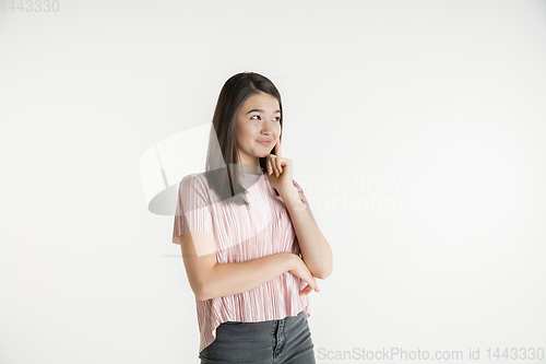 Image of Beautiful girl\'s half-length portrait on white studio background