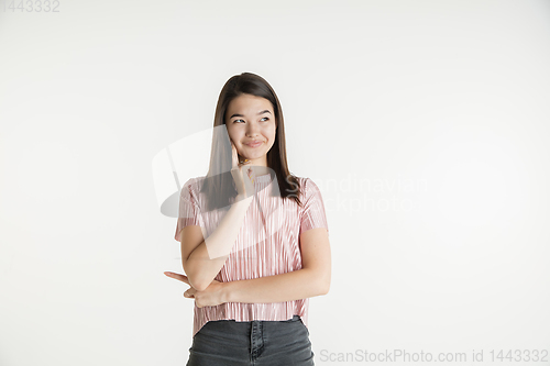 Image of Beautiful girl\'s half-length portrait on white studio background