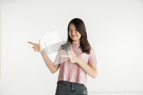 Image of Beautiful girl\'s half-length portrait on white studio background