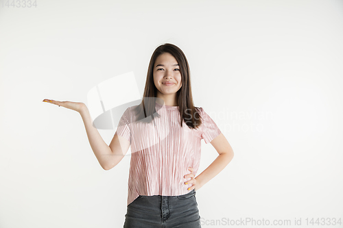 Image of Beautiful girl\'s half-length portrait on white studio background