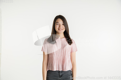 Image of Beautiful girl\'s half-length portrait on white studio background