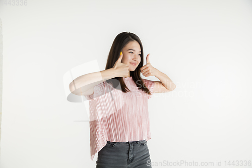 Image of Beautiful girl\'s half-length portrait on white studio background