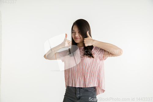 Image of Beautiful girl\'s half-length portrait on white studio background