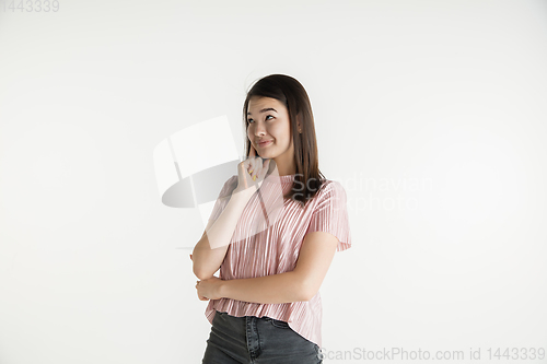 Image of Beautiful girl\'s half-length portrait on white studio background