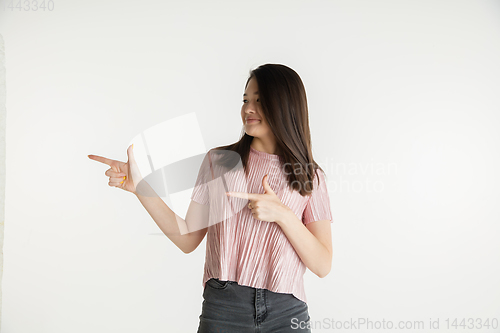 Image of Beautiful girl\'s half-length portrait on white studio background