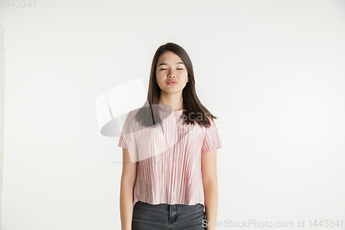 Image of Beautiful girl\'s half-length portrait on white studio background