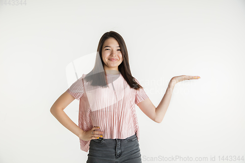 Image of Beautiful girl\'s half-length portrait on white studio background