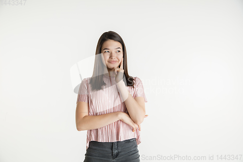 Image of Beautiful girl\'s half-length portrait on white studio background