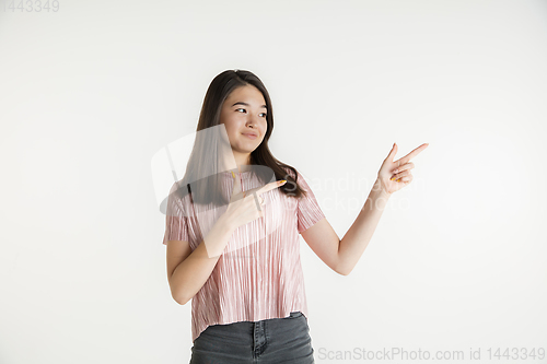 Image of Beautiful girl\'s half-length portrait on white studio background