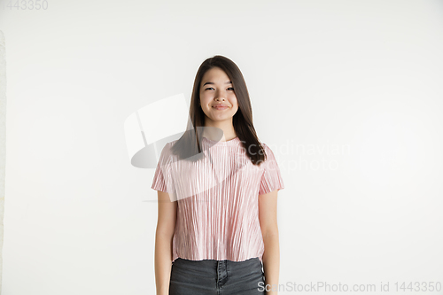 Image of Beautiful girl\'s half-length portrait on white studio background