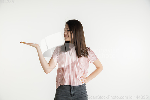 Image of Beautiful girl\'s half-length portrait on white studio background