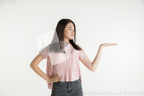 Image of Beautiful girl\'s half-length portrait on white studio background