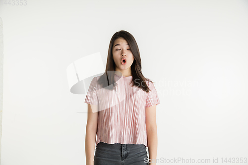 Image of Beautiful girl\'s half-length portrait on white studio background