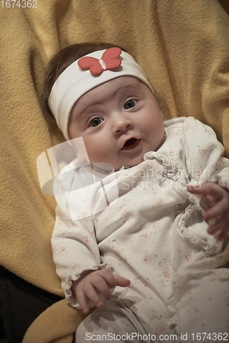 Image of portrait of happy newborn little baby smilling