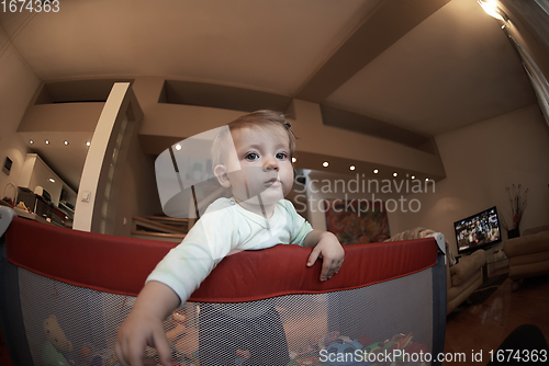 Image of cute little baby playing in mobile bed