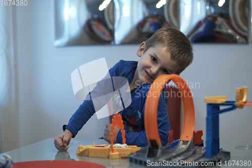 Image of Father and children playing car toy game