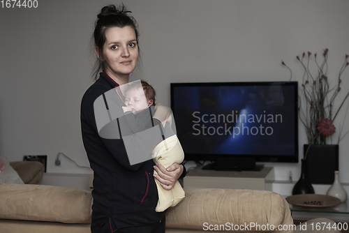 Image of mother is playing with baby at home