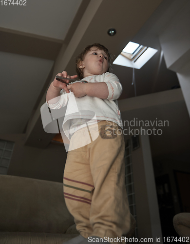 Image of Adorable cute beautiful little baby girl playing with toys at home