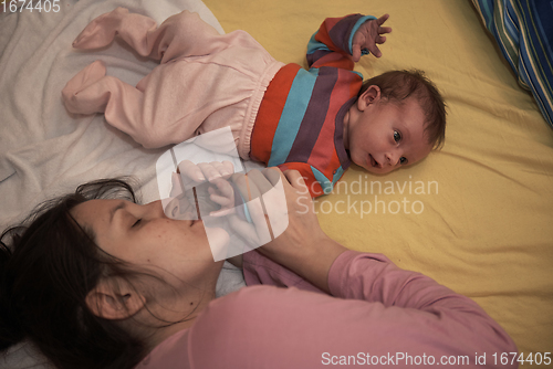 Image of mother is playing with baby at home