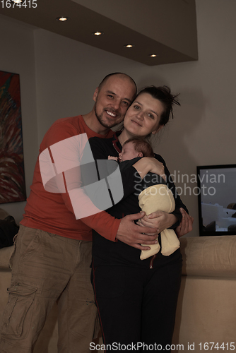 Image of young family portrait with newborn baby