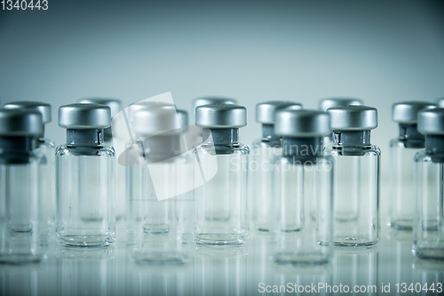 Image of Vaccine glass bottles on grey background