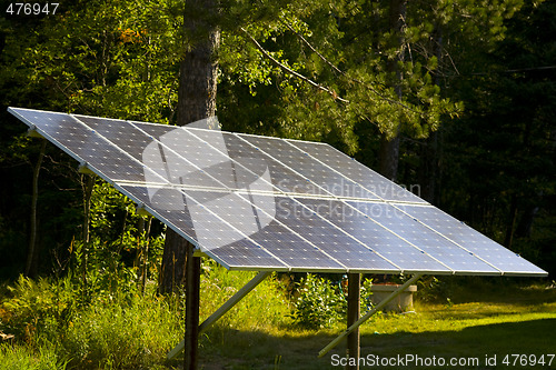 Image of Solar Panel in a Forest Sunbeam