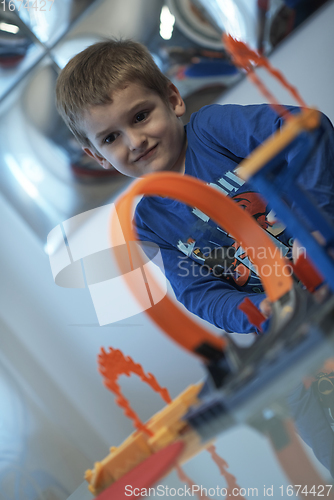 Image of Father and children playing car toy game