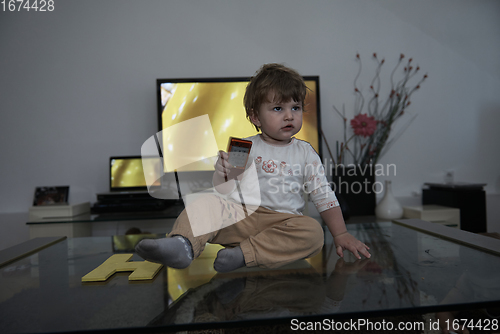 Image of Adorable cute beautiful little baby girl playing with toys at home