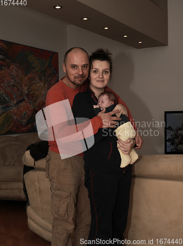 Image of young family portrait with newborn baby