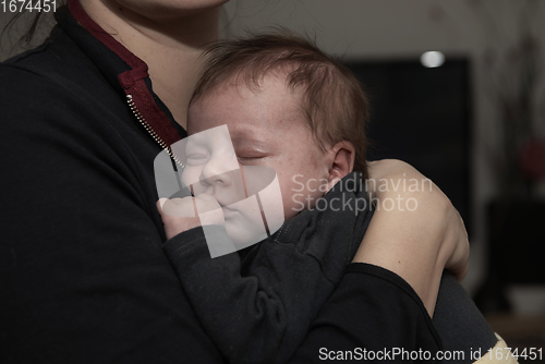 Image of mother is playing with baby at home