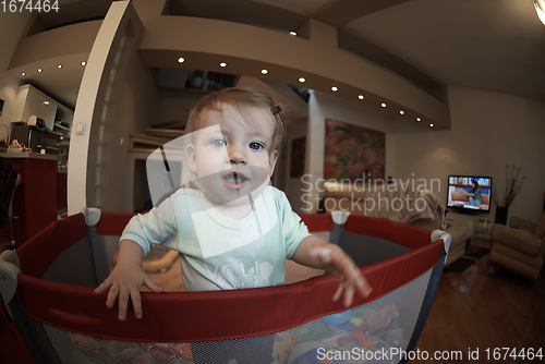 Image of cute little baby playing in mobile bed