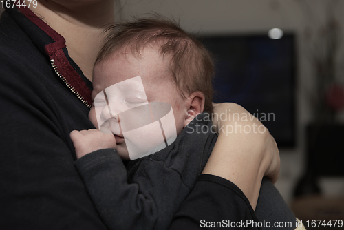 Image of mother is playing with baby at home