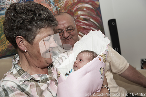 Image of family portrait with grandparents parents and baby