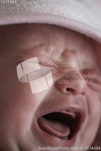 Image of newborn baby crying and screaming