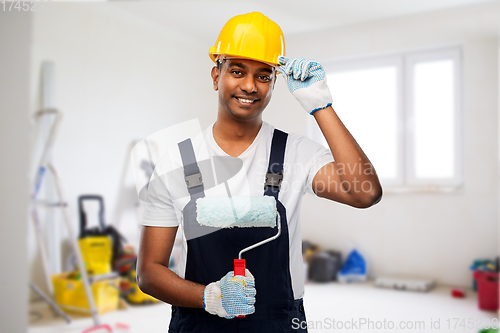 Image of happy indian painter or builder with paint roller