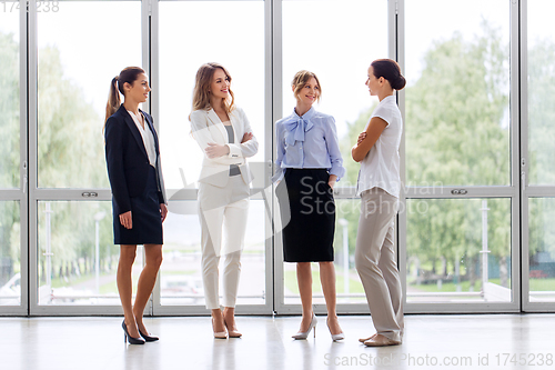 Image of businesswomen meeting at office and talking