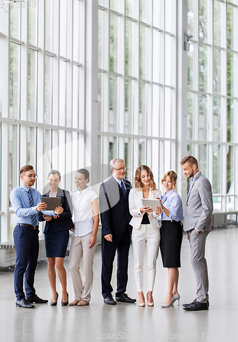 Image of business people with tablet pc computers at office
