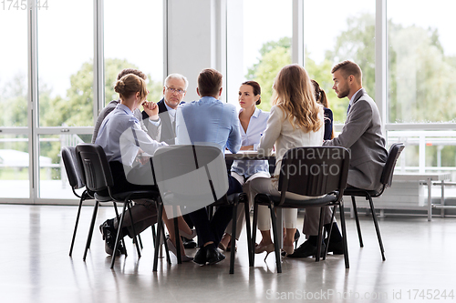 Image of business team meeting at office