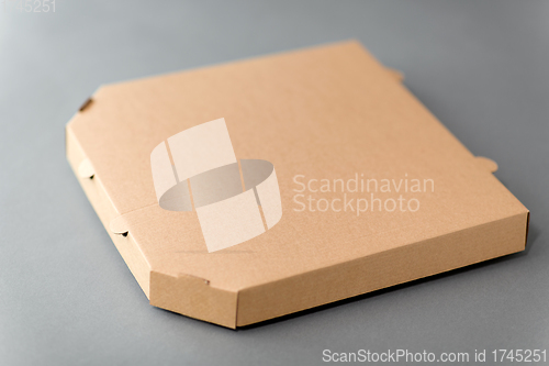 Image of takeaway food or pizza in brown paper box