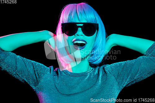 Image of happy woman in pink wig and black sunglasses