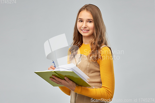 Image of teenage student girl with notebook or diary