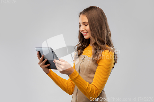 Image of teenage girl using tablet computer