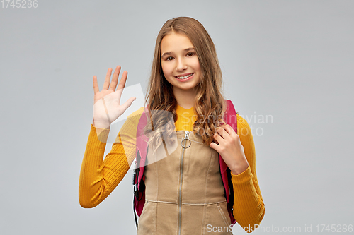 Image of smiling teenage student girl with backpack