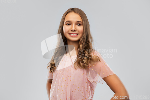 Image of smiling young teenage girl in party dress