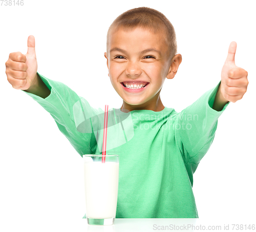 Image of Cute boy with a glass of milk