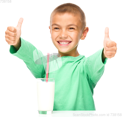 Image of Cute boy with a glass of milk