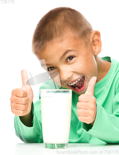 Image of Cute boy with a glass of milk