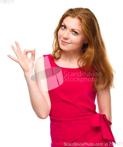 Image of Woman is showing OK sign