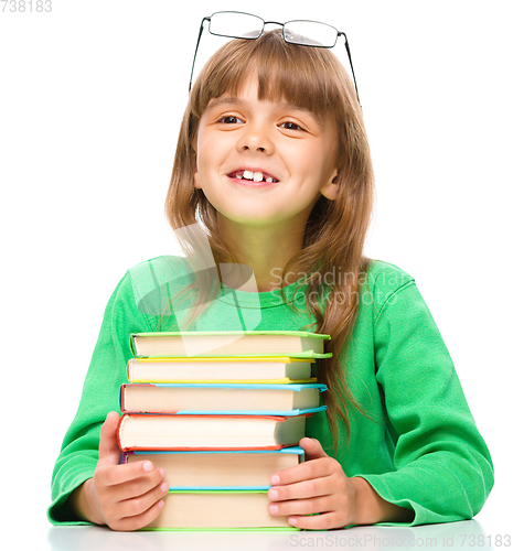 Image of Little girl is reading a book